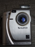 FUJIFILM Finepix 4700Zoom 2.4MP metal silver Digital Camera.Lens Error-Cost ?175