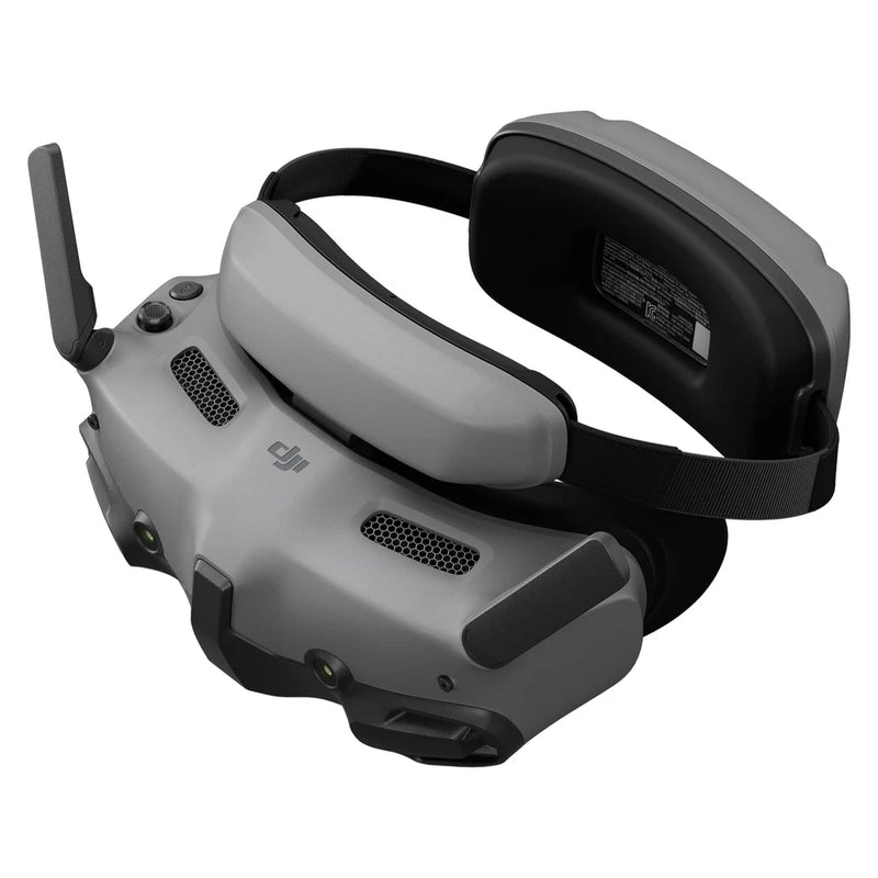 DJI FPV goggles with black strap and gray headset, side antenna and vents