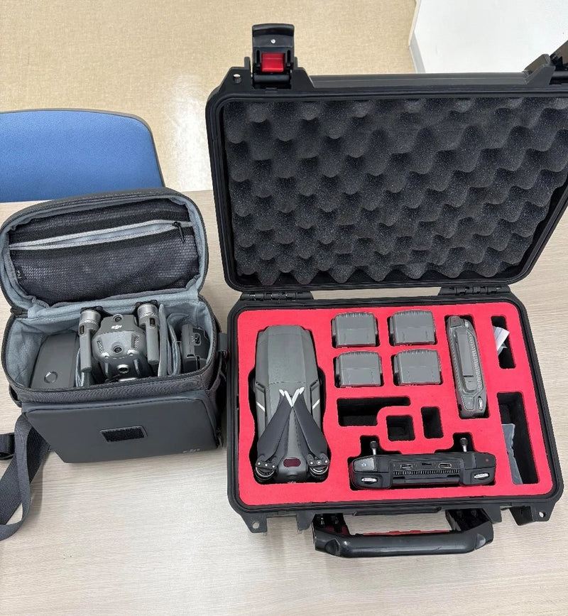 Hard-shell drone case with foam inserts and remote controller, open view