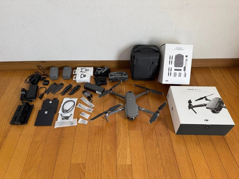 Camera drone and accessories set with controller, batteries, cables, and carrying case