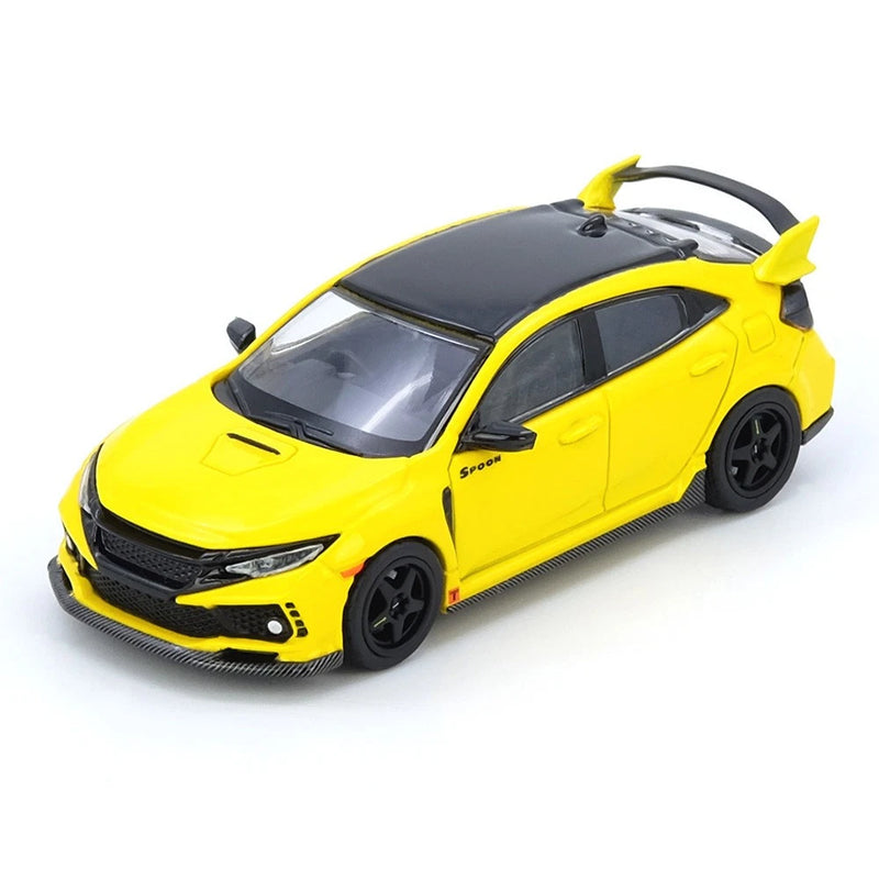 Yellow 1:64 scale model car with black hood, front 3/4 view, rear spoiler, black wheels