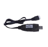 Black USB battery charger adapter with cable and output label, USB connector