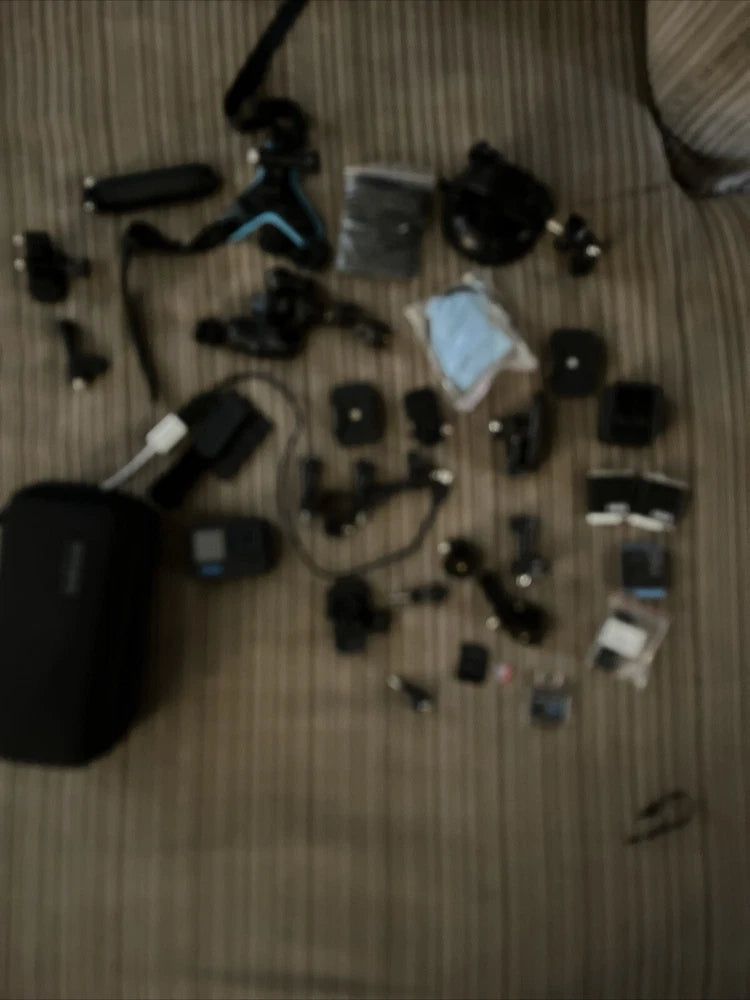 GoPro action camera kit with multiple mounts and small accessories