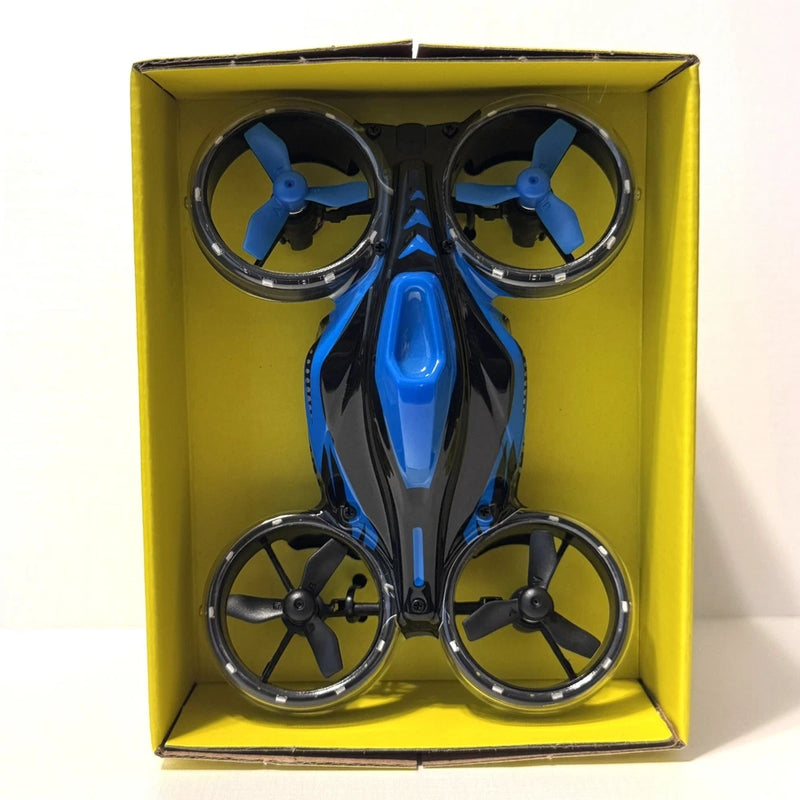 Blue and black mini drone with four propellers, shown in retail box