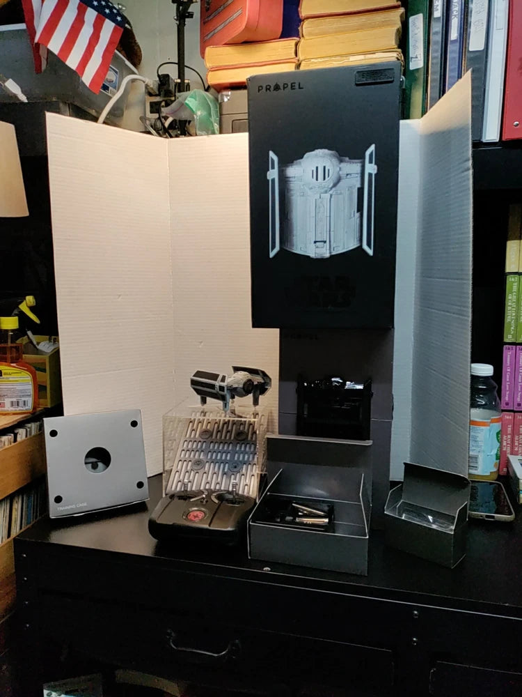 Small quadcopter battle drone with controller and packaging on display