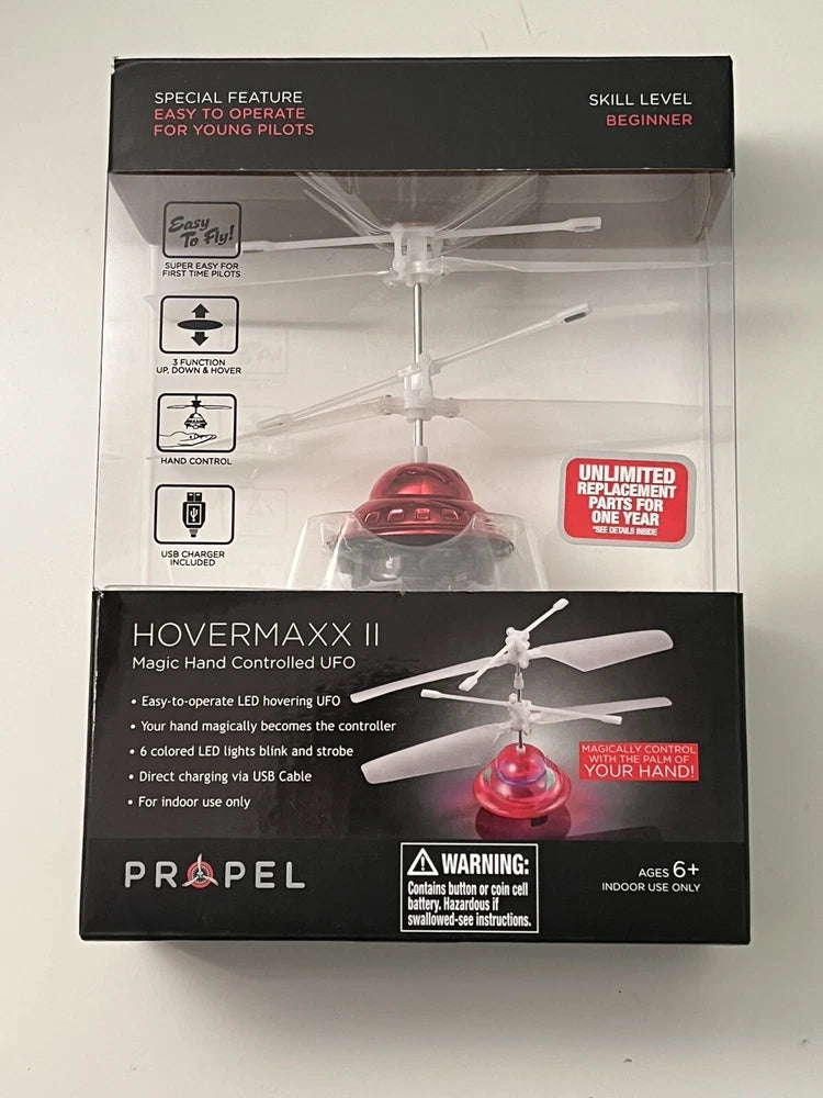 Red hand-controlled UFO propeller drone toy in retail box