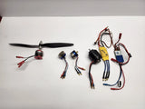 Brushless drone motor and ESC components with wiring harness and connectors.