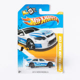 White and blue race car die-cast model in blister pack, Ford logo on card