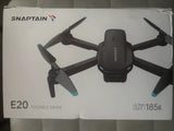 Foldable ultra-light drone with four propellers and blue tips, in retail box
