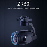 Black gimbal camera pod with zoom lens and cylindrical housing