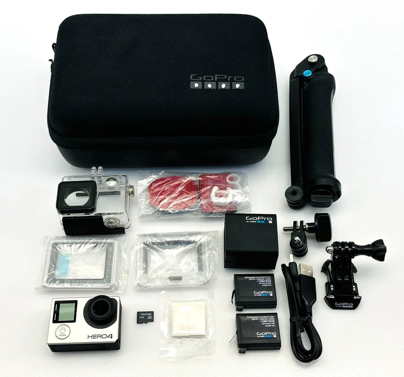 GoPro Hero4 action camera bundle with case, mounts, battery, cables, and waterproof housing