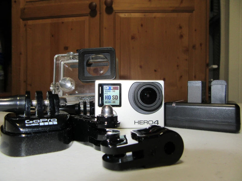 GoPro HERO4 Black action camera with waterproof housing and mount accessories