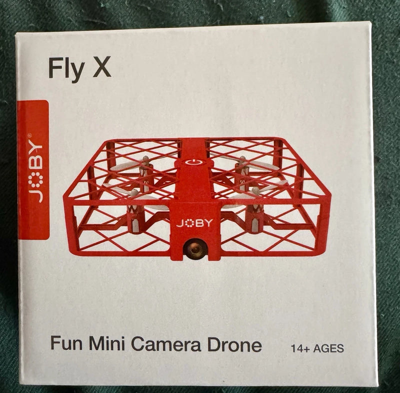 Mini camera drone with red enclosed propeller guard and front camera
