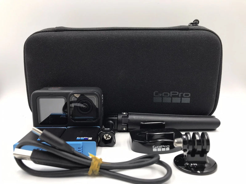 GoPro action camera kit with waterproof housing, mount, cables, and carry case