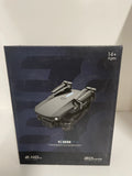 E88 Pro drone in retail box, gray quadcopter with folded arms