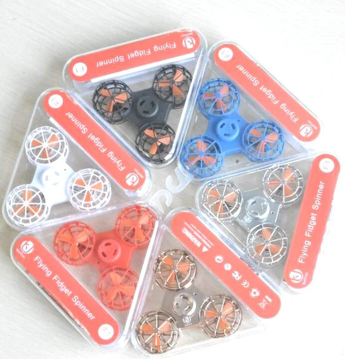 Mini flying fidget spinner hand drones in assorted colors, blister pack set