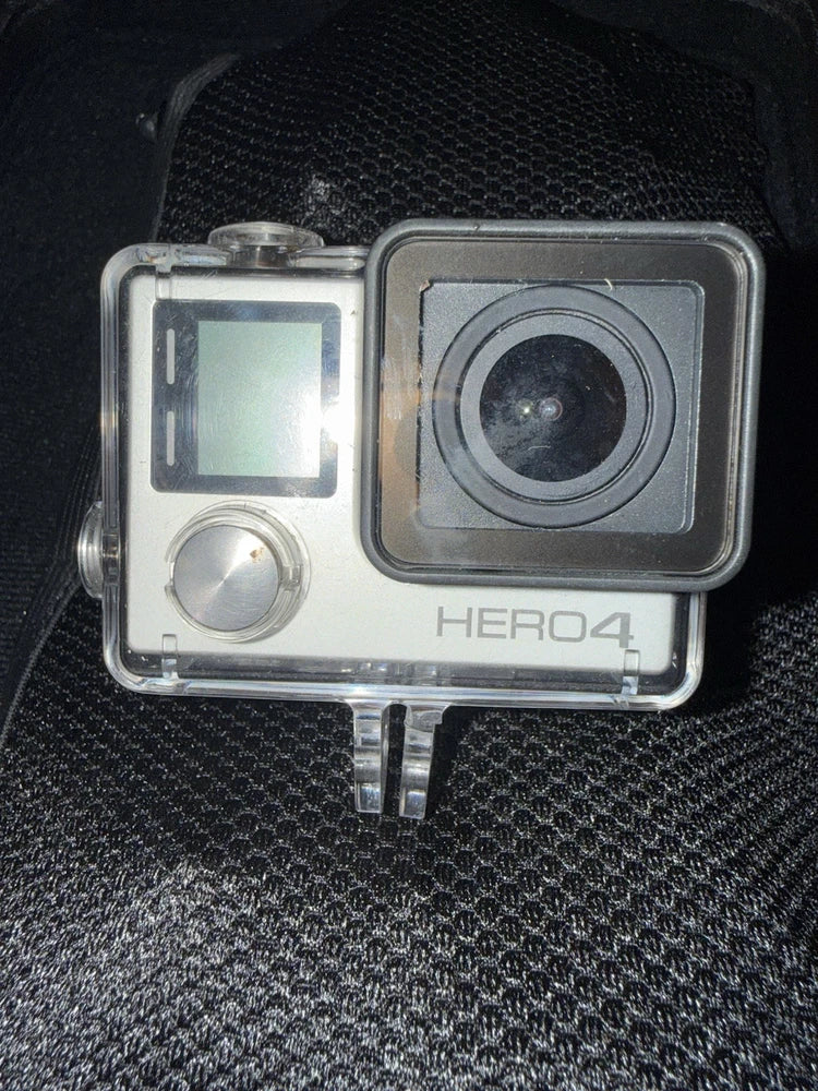 GoPro HERO4 Silver action camera in clear housing with front lens and LCD screen