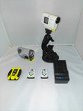 White HD action camera on black mount with battery charger, cables, and accessories