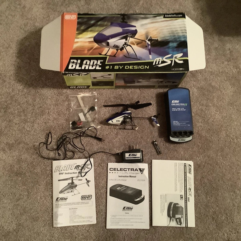 RC helicopter kit box with Blade MSR RC helicopter, manuals, and electronic components