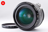Nikon NIKKOR 28mm f/2.8 manual focus camera lens with front glass and metal ring