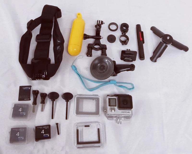 GoPro HERO4 action camera kit with mounting accessories, housings, and strap
