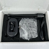 Black mini body camera with lanyard, cable, and accessories in foam insert