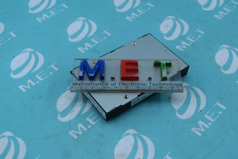 Metal-cased DC-DC converter with green terminal block and multi-pin connector strip.