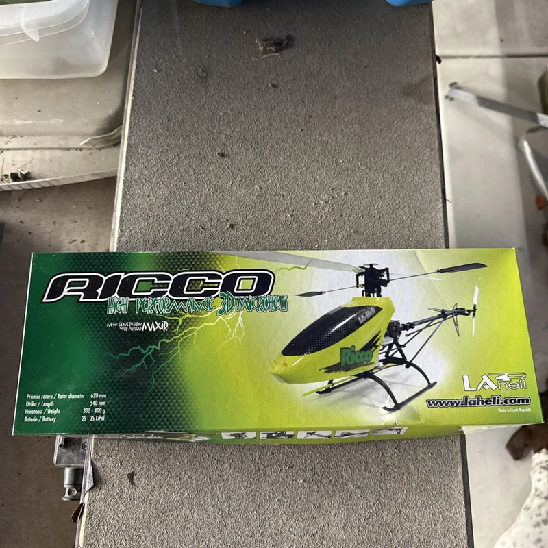 RC micro helicopter kit box with green and yellow graphics and rotor helicopter illustration