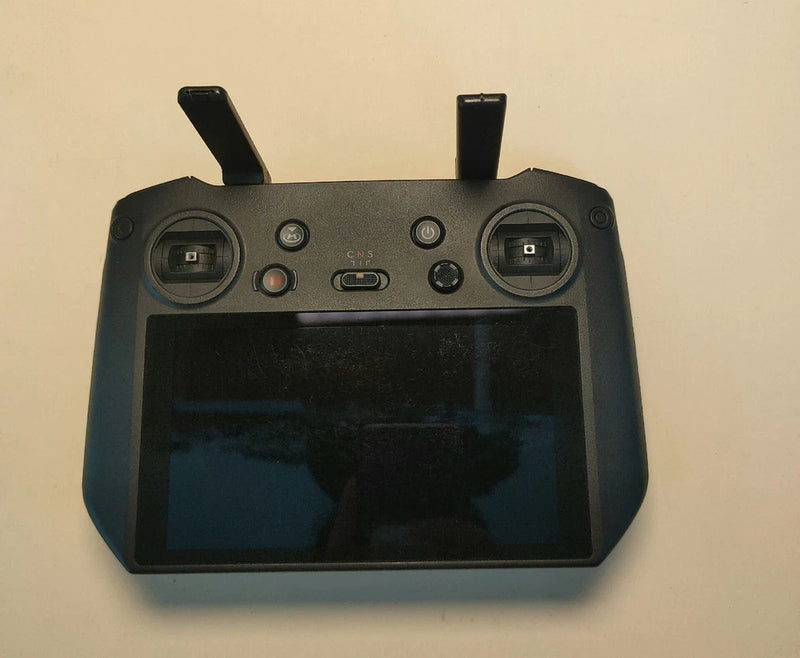 Black drone remote controller with screen and dual joysticks