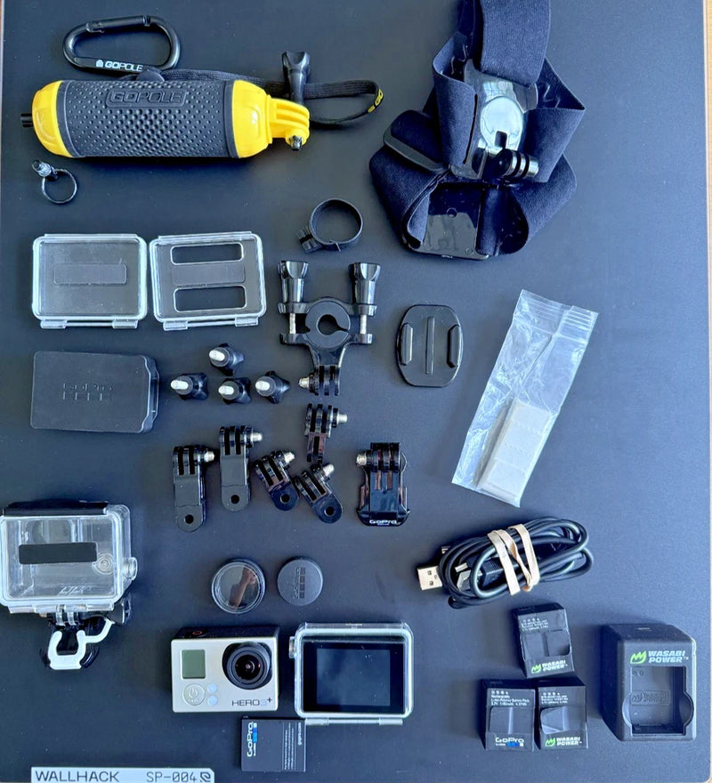 Action camera bundle with LCD, mounts, batteries, cables, and protective cases