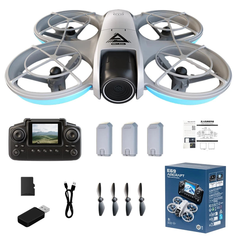 Grey quadcopter drone with propeller guards and camera, plus controller and accessories