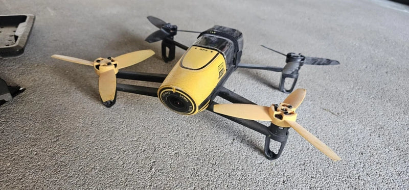 Parrot Bebop quadcopter drone with yellow camera pod and four propellers