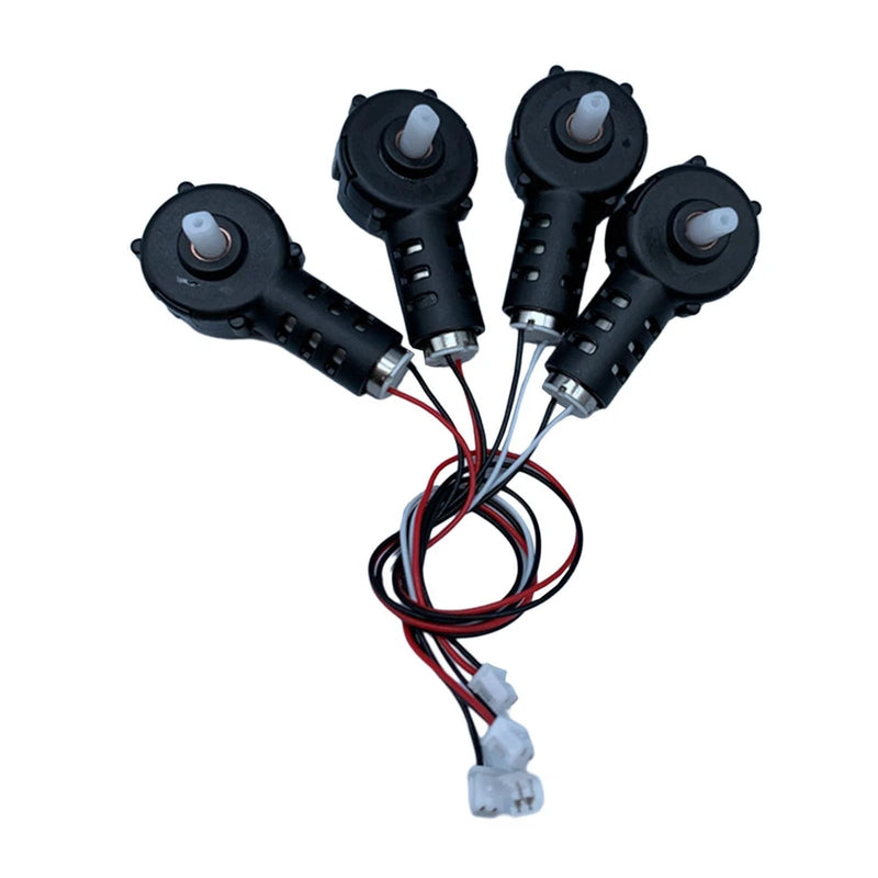 Four black RC drone motors with wiring harness and connectors