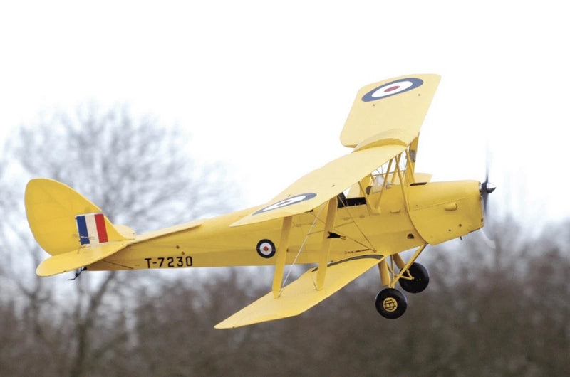Yellow radio-controlled biplane airplane model with exposed framework and landing gear