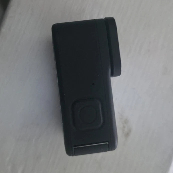GoPro action camera in black, side body with button and lens housing