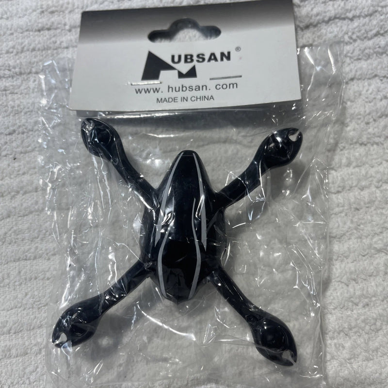Black drone body frame with four arms and central mount, in clear packaging