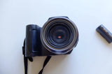 Fujifilm FinePix 6900 compact camera with exposed lens and strap