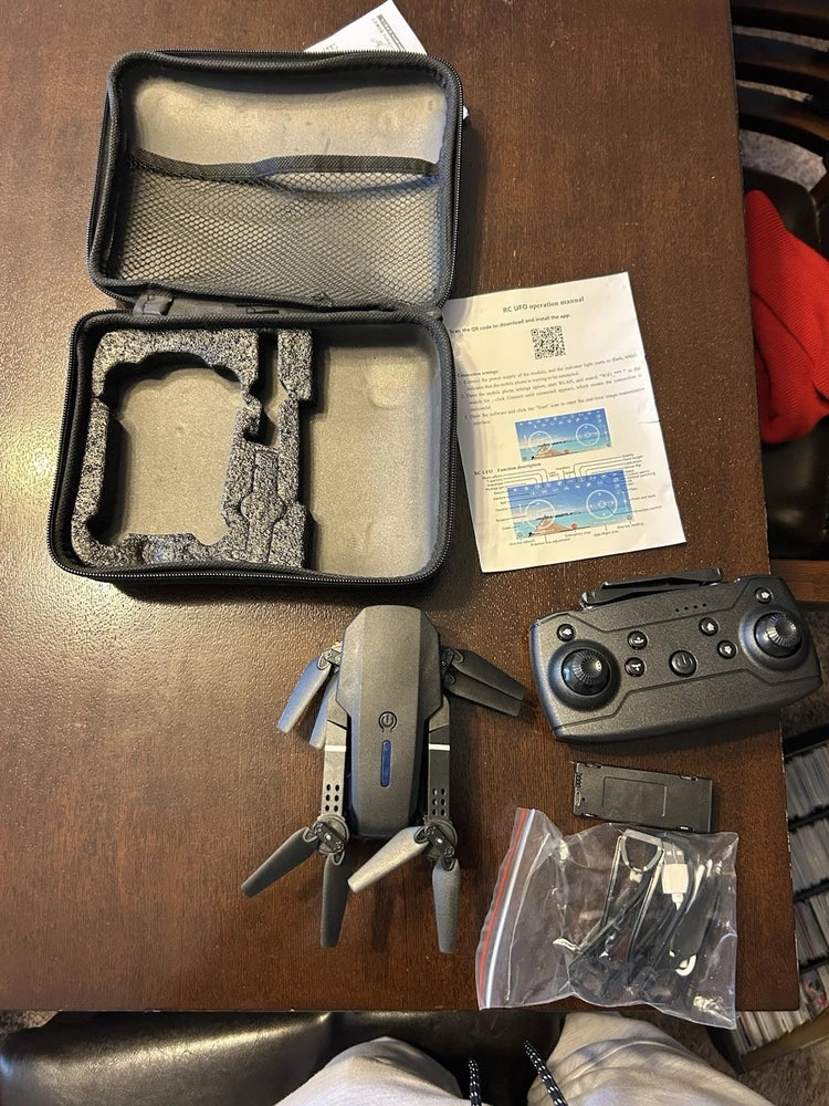 Kids RC UFO drone kit with controller, spare parts, and protective carry case