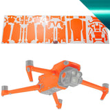 Orange and white drone skin sticker sheet with abstract graphics for WRAPGRADE drone