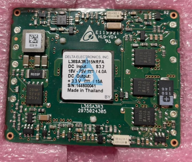 Green DC-DC converter PCB module with mounting holes and integrated components