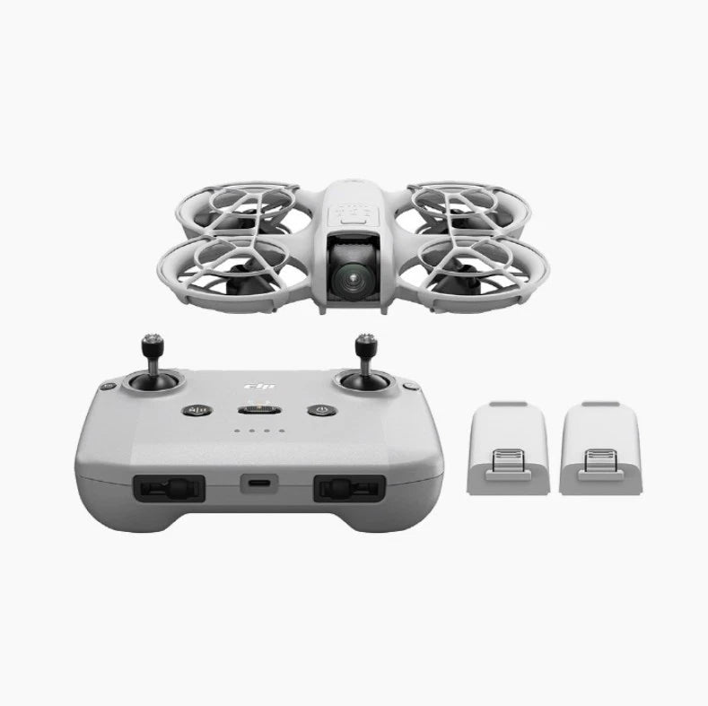 Foldable drone with controller and two spare batteries, front view