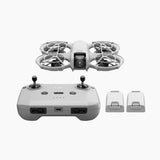 Foldable drone with controller and two spare batteries, front view
