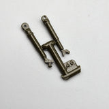 Metal missile battery parts piece with two hinges and stamped '46' marking