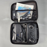E99 Pro Foldable WiFi FPV Camera Drone w Remote Carrying Case Powers On