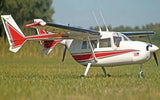 White and red RC twin-engine airplane model with propellers