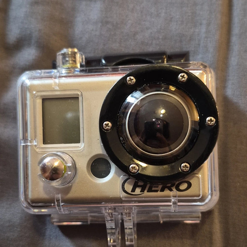 GoPro HERO action camera in clear waterproof housing with LCD screen and front lens
