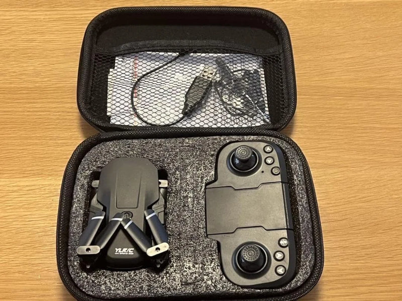 Compact mini quadcopter drone with camera, packed in a zippered carrying case