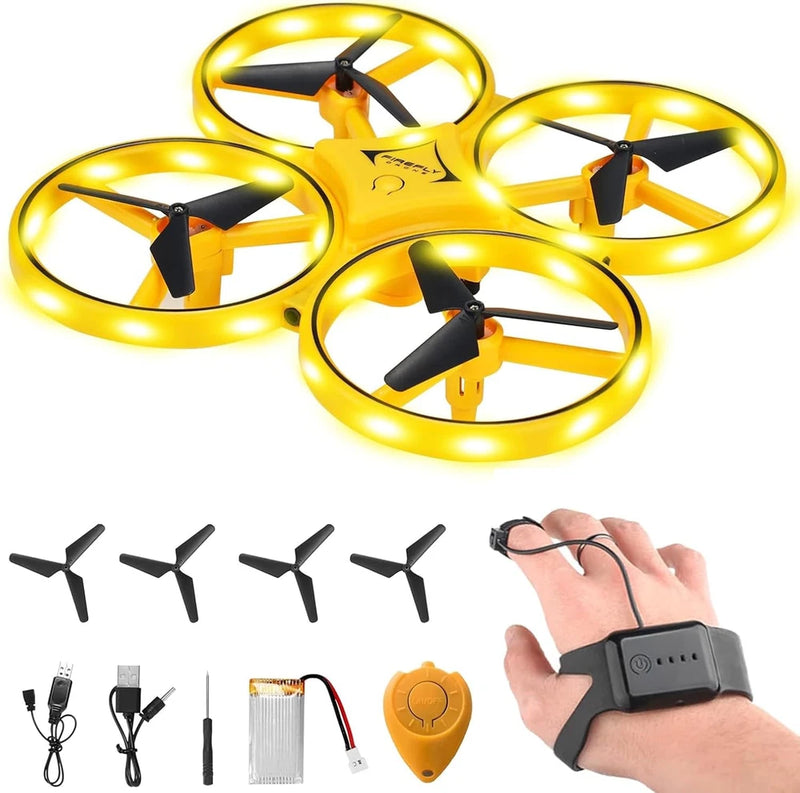 Yellow LED quadcopter drone with four propellers and controller shown with a hand