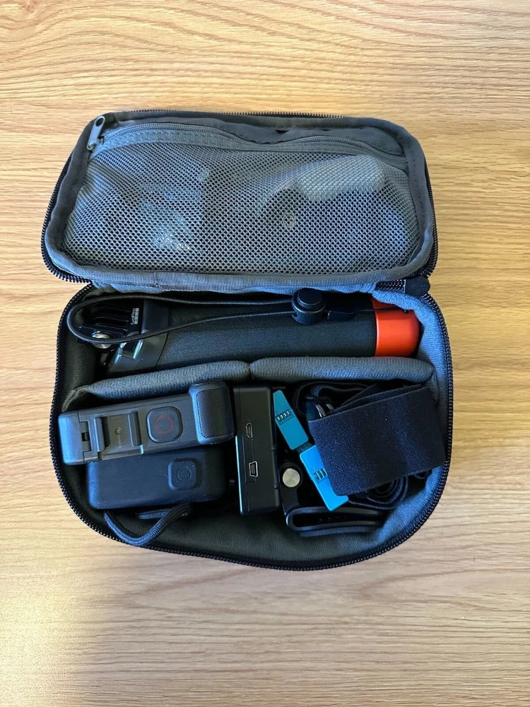 GoPro HERO8 action camera and accessories in open black zip case, scuba mounting parts