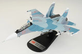 1/72 Su-30SM model aircraft with light blue and gray finish, red markings, on display stand